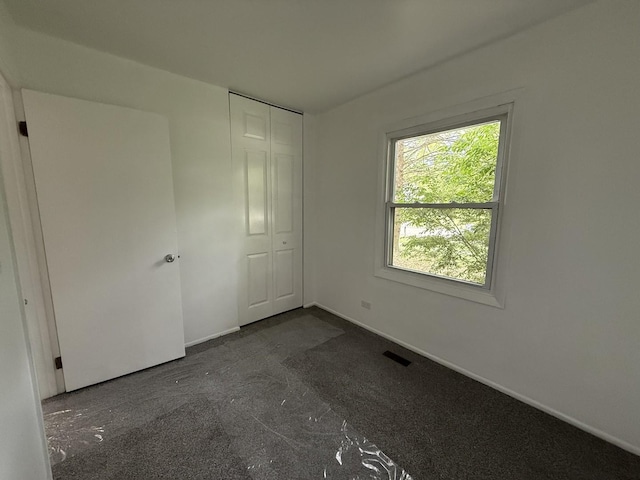217 Davis Ln, Bolingbrook, IL 60440 - unfurnished bedroom with baseboards and a closet
