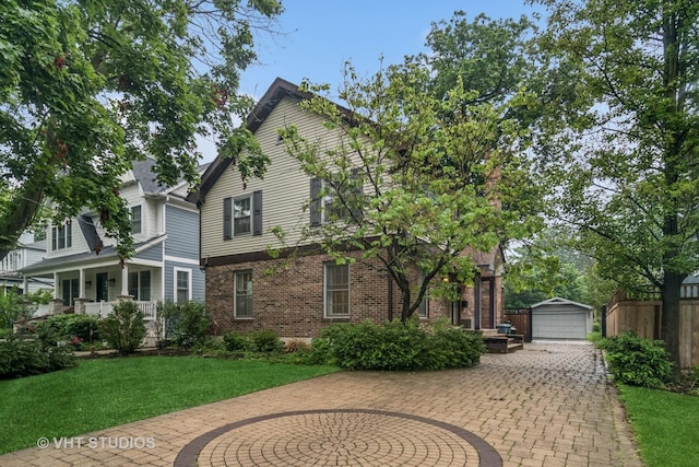 827 Forest Ave, River Forest, IL 60305 - view of front of property featuring an outdoor structure, a detached garage, brick siding, and a porch