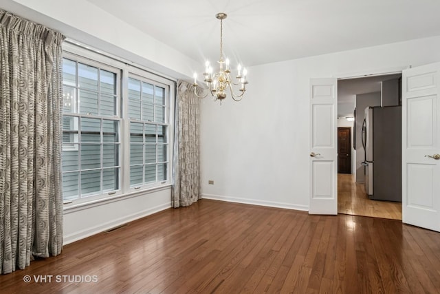 827 Forest Ave, River Forest, IL 60305 - spare room featuring a chandelier and wood finished floors
