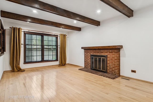 827 Forest Ave, River Forest, IL 60305 - unfurnished living room with wood finished floors, a fireplace, beamed ceiling, and recessed lighting