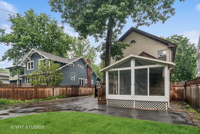 827 Forest Ave, River Forest, IL 60305 - rear view of house featuring a sunroom and a fenced backyard