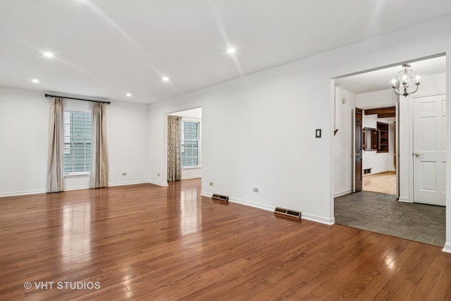 827 Forest Ave, River Forest, IL 60305 - empty room with a chandelier, wood finished floors, and recessed lighting