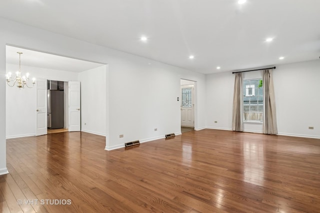 827 Forest Ave, River Forest, IL 60305 - unfurnished room with a chandelier, hardwood / wood-style flooring, and recessed lighting