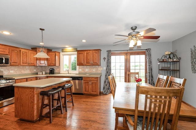 8147 Nielsen Dr, Tinley Park, IL 60477 - kitchen with appliances with stainless steel finishes, light countertops, a center island, healthy amount of natural light, and recessed lighting