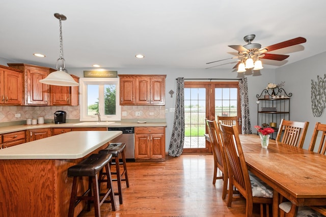 8147 Nielsen Dr, Tinley Park, IL 60477 - kitchen with dishwasher, light wood-style floors, light countertops, tasteful backsplash, and recessed lighting