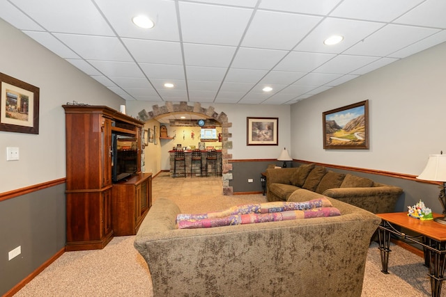 8147 Nielsen Dr, Tinley Park, IL 60477 - living area featuring light colored carpet, bar area, recessed lighting, and arched walkways