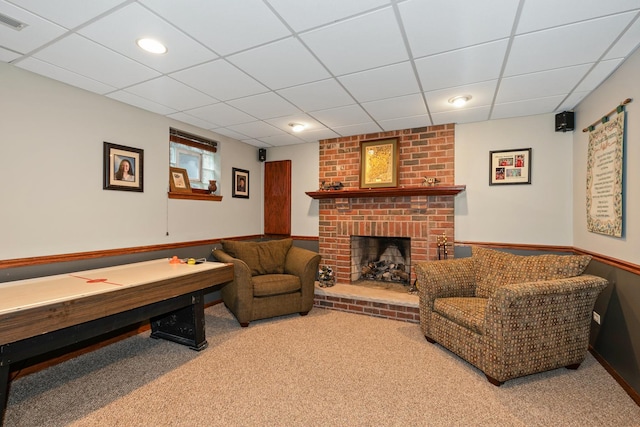 8147 Nielsen Dr, Tinley Park, IL 60477 - living area featuring a drop ceiling, a brick fireplace, and carpet floors