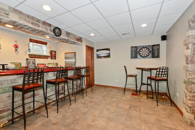 8147 Nielsen Dr, Tinley Park, IL 60477 - indoor dry bar with stainless steel refrigerator, a paneled ceiling, tile patterned floors, and recessed lighting