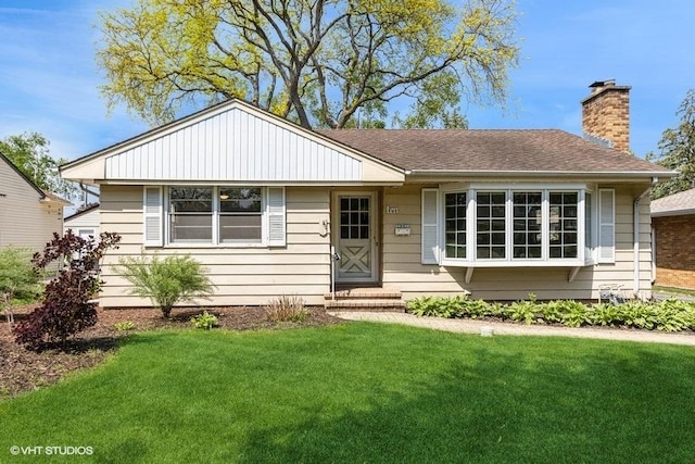 10 N Waverly Pl, Mount Prospect, IL 60056 - view of front of property featuring a front yard and a chimney