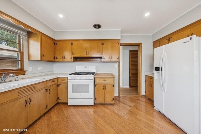 10 N Waverly Pl, Mount Prospect, IL 60056 - kitchen featuring white appliances, a sink, light countertops, light wood-style flooring, and brown cabinetry