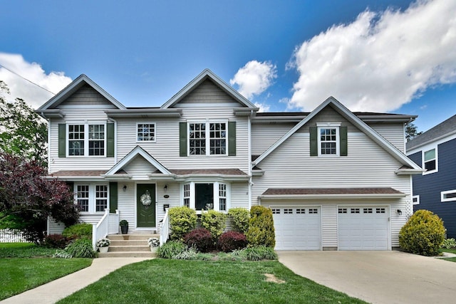 traditional home with driveway, a garage, and a front lawn
