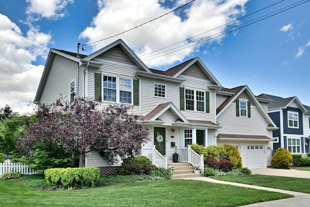 view of front of property featuring concrete driveway, an attached garage, and a shingled roof