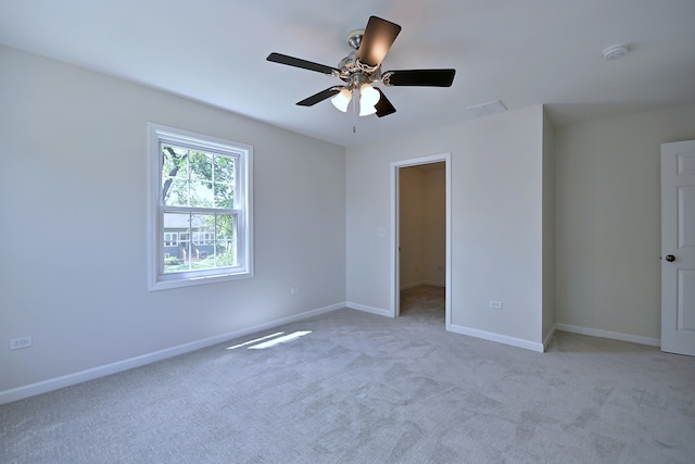 unfurnished bedroom with carpet flooring, baseboards, and ceiling fan