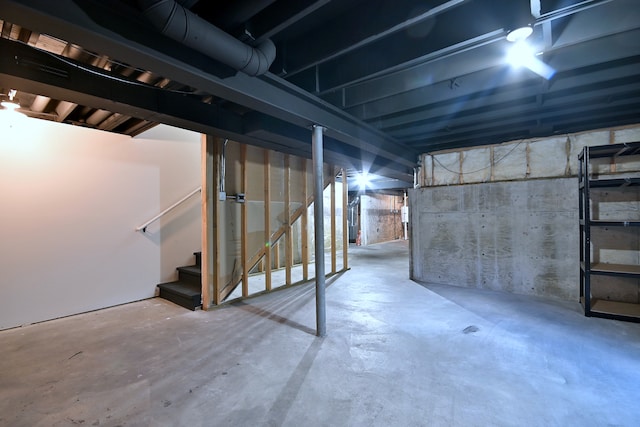 unfinished basement with stairs