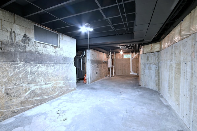 basement with heating unit and water heater