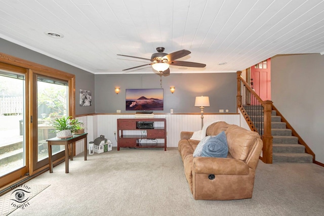 623 Woodstock Ln, Bourbonnais, IL 60914 - living room with carpet floors, stairway, a ceiling fan, a wainscoted wall, and ornamental molding