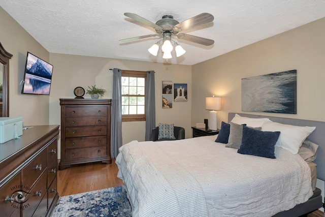 623 Woodstock Ln, Bourbonnais, IL 60914 - bedroom with wood finished floors, a textured ceiling, and ceiling fan