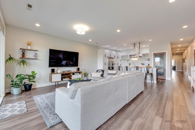 2860 N Milwaukee Ave Unit 2S, Chicago, IL 60618 - living area with light wood-type flooring, baseboards, and recessed lighting
