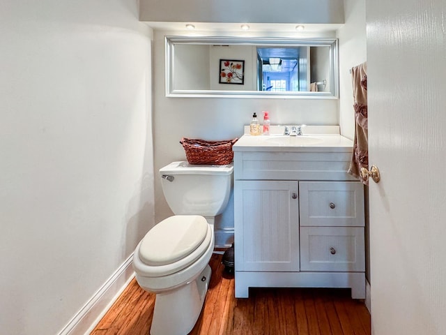 1703 S Ruble St, Chicago, IL 60616 - bathroom with wood finished floors, toilet, vanity, and baseboards