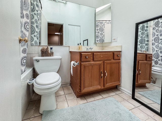 1703 S Ruble St, Chicago, IL 60616 - bathroom with toilet, vanity, and tile patterned floors