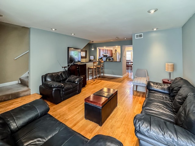 1703 S Ruble St, Chicago, IL 60616 - living area featuring wood finished floors, stairway, baseboards, and recessed lighting