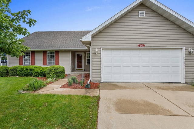 610 Chestnut Dr, Saint Joseph, IL 61873 - traditional-style house featuring driveway, an attached garage, roof with shingles, and a front yard