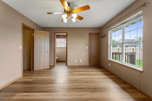 610 Chestnut Dr, Saint Joseph, IL 61873 - spare room featuring ceiling fan, light wood-type flooring, and baseboards