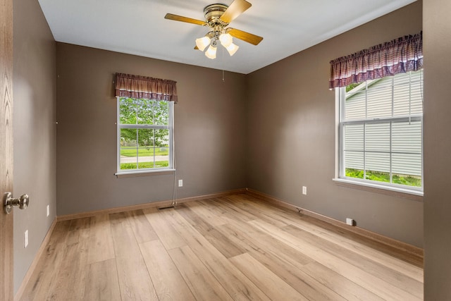 610 Chestnut Dr, Saint Joseph, IL 61873 - unfurnished room with light wood-type flooring, ceiling fan, and baseboards