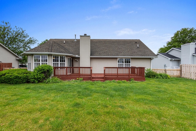 610 Chestnut Dr, Saint Joseph, IL 61873 - rear view of property with a chimney, a wooden deck, and roof with shingles