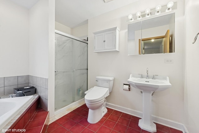 bathroom with a stall shower, toilet, tile patterned flooring, and baseboards