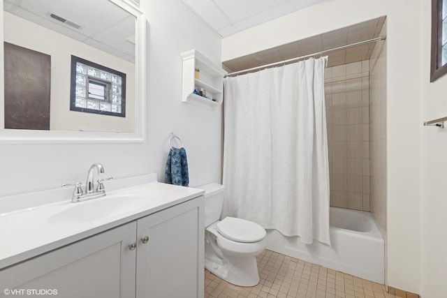 bathroom with tile patterned floors, toilet, vanity, and shower / bath combo