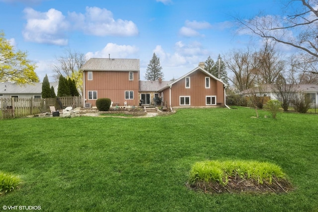 rear view of property with a patio and roof with shingles