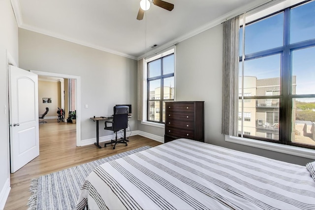 4440 N Kedzie Ave Unit 401, Chicago, IL 60625 - bedroom featuring ornamental molding, wood finished floors, baseboards, a desk, and ceiling fan