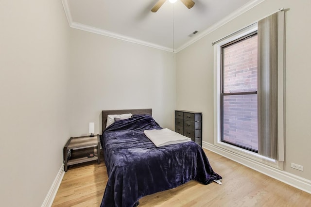 4440 N Kedzie Ave Unit 401, Chicago, IL 60625 - bedroom with light wood-style flooring, ornamental molding, baseboards, and ceiling fan