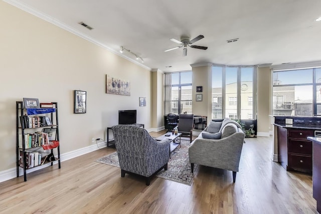 4440 N Kedzie Ave Unit 401, Chicago, IL 60625 - living room featuring crown molding, a ceiling fan, light wood-style flooring, track lighting, and baseboards