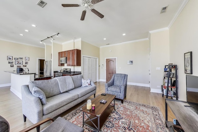 4440 N Kedzie Ave Unit 401, Chicago, IL 60625 - living area featuring light wood-type flooring, ceiling fan, crown molding, baseboards, and recessed lighting