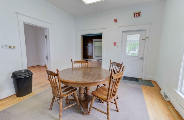 206 N Pine St, Villa Grove, IL 61956 - dining area featuring light wood-style flooring and baseboards