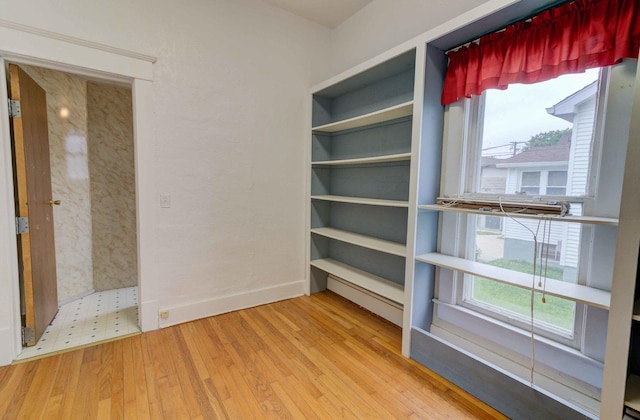 206 N Pine St, Villa Grove, IL 61956 - unfurnished room featuring wood finished floors and baseboards