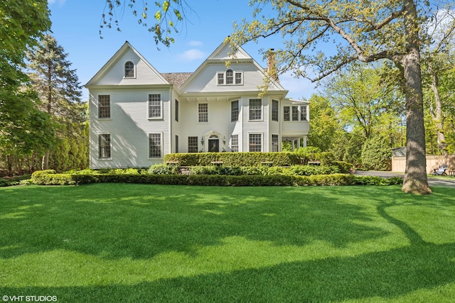 550 Rosemary Rd, Lake Forest, IL 60045 - back of house with a chimney and a yard