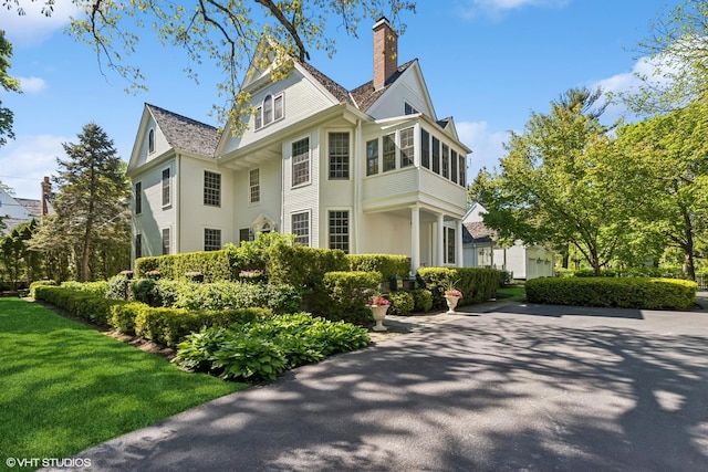 550 Rosemary Rd, Lake Forest, IL 60045 - view of home's exterior featuring a chimney and a yard