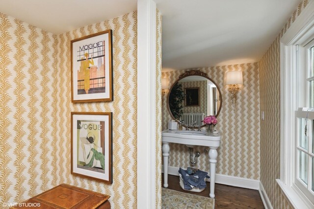 550 Rosemary Rd, Lake Forest, IL 60045 - detailed view of wallpapered walls, wood finished floors, baseboards, and radiator heating unit