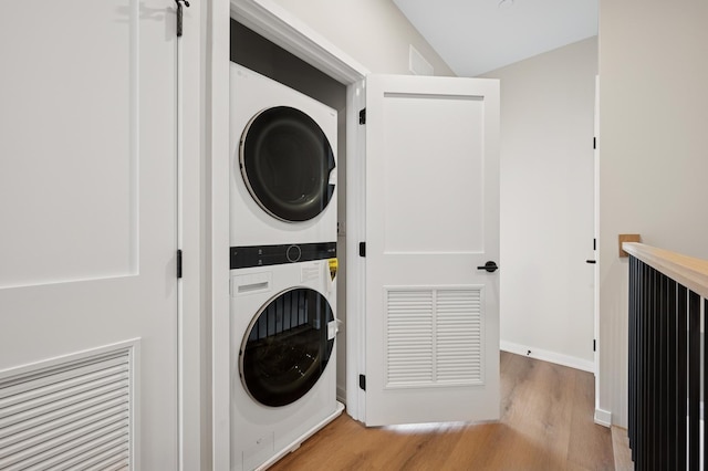 944 Beloit Ave Unit 2, Forest Park, IL 60130 - laundry area with stacked washer / drying machine, light wood-type flooring, and baseboards