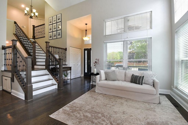 1112 Laurel Ln, Gurnee, IL 60031 - living room with a high ceiling, dark wood-style floors, stairs, baseboards, and a chandelier