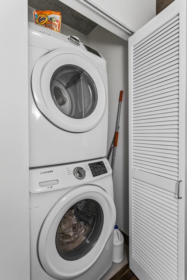 laundry room featuring stacked washer and clothes dryer