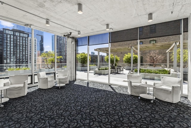 common area featuring floor to ceiling windows and a view of city