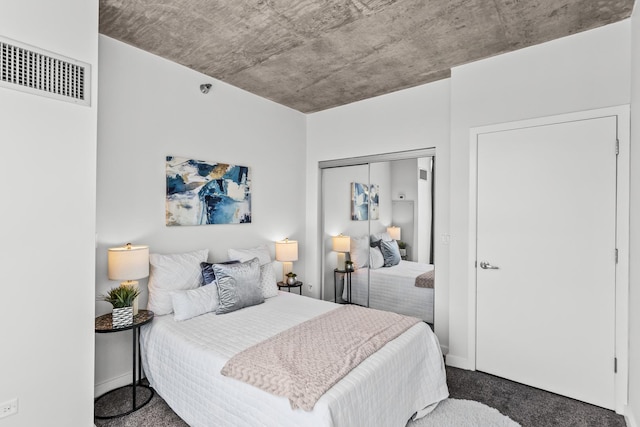 carpeted bedroom with a closet