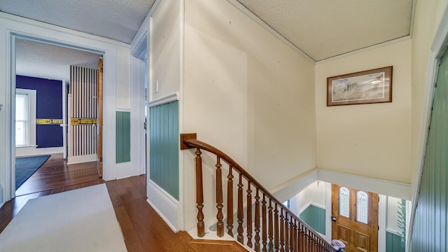 321 E Chamberlin St, Dixon, IL 61021 - hallway with an upstairs landing, wood finished floors, a textured ceiling, and baseboards