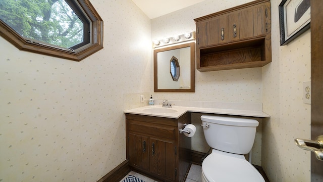 321 E Chamberlin St, Dixon, IL 61021 - half bathroom featuring wallpapered walls, toilet, and vanity