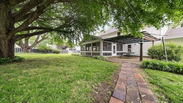 321 E Chamberlin St, Dixon, IL 61021 - view of yard with a sunroom, a pergola, and a patio