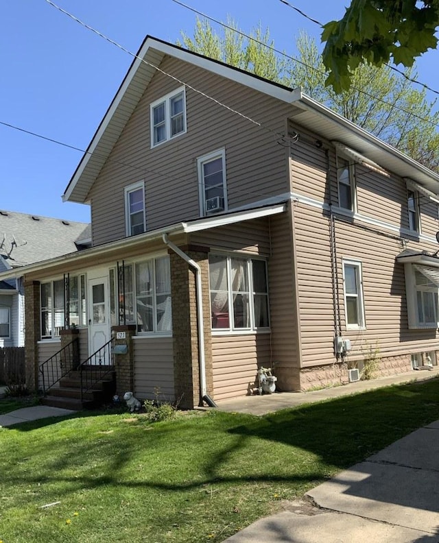 523 Edwards St, Aurora, IL 60505 - view of property exterior with a lawn and brick siding
